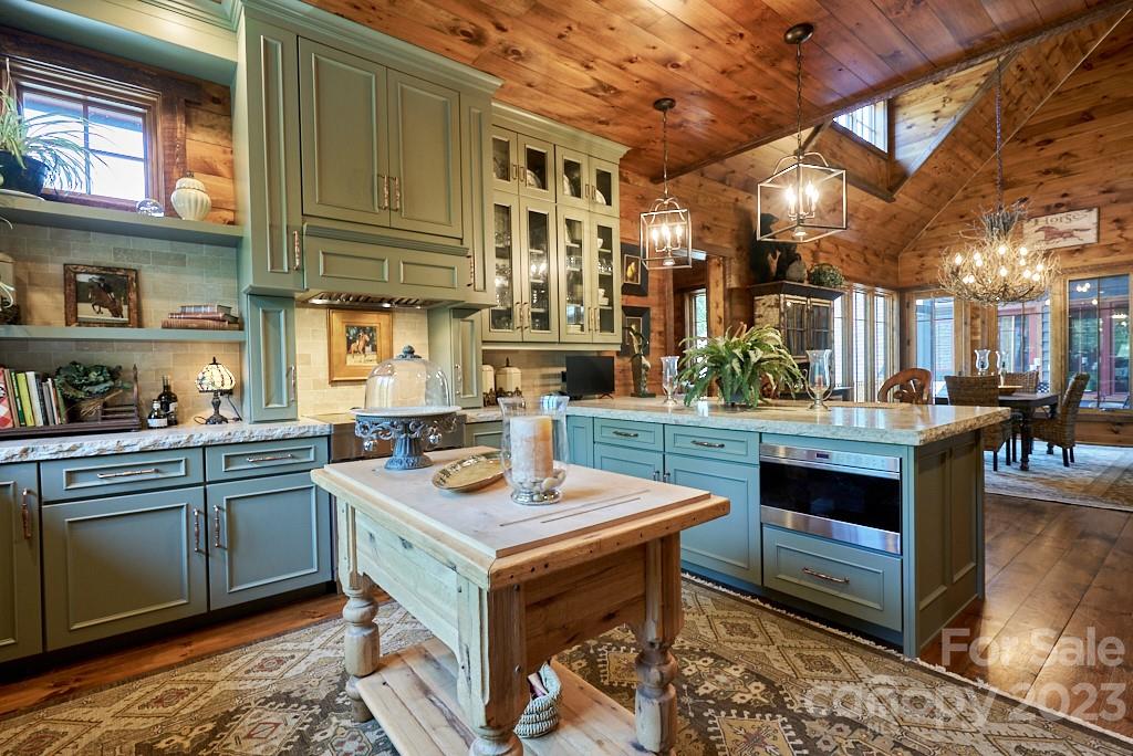 800 Collinsville Road Columbus, NC 28722 - Photo 24 of 33 a open kitchen with stainless steel appliances granite countertop a stove and a sink