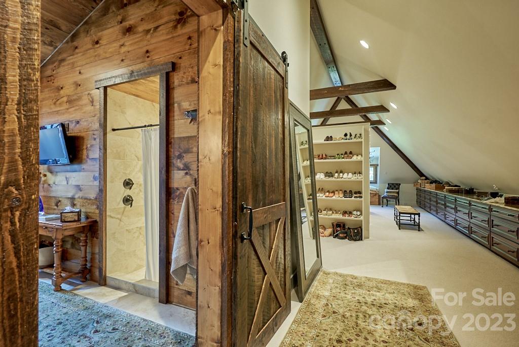 800 Collinsville Road Columbus, NC 28722 - Photo 28 of 33 a view of a hallway with wooden floor and staircase