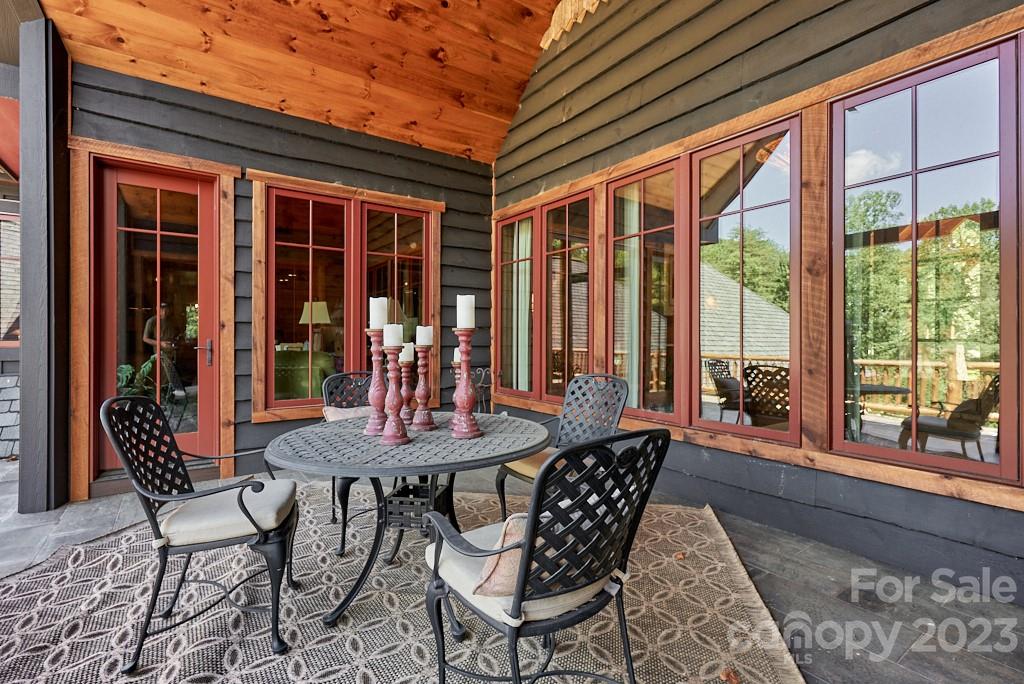 800 Collinsville Road Columbus, NC 28722 - Photo 33 of 33 a dining room with furniture wooden floor and a potted plant