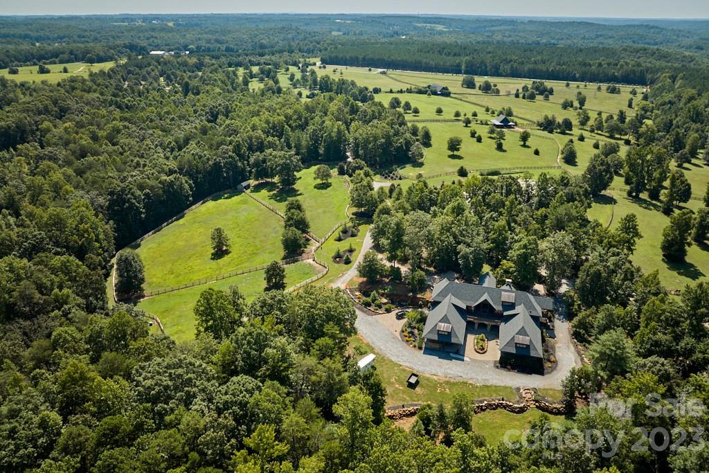 800 Collinsville Road Columbus, NC 28722 - Photo 4 of 33 an aerial view of a house with a yard and lake view