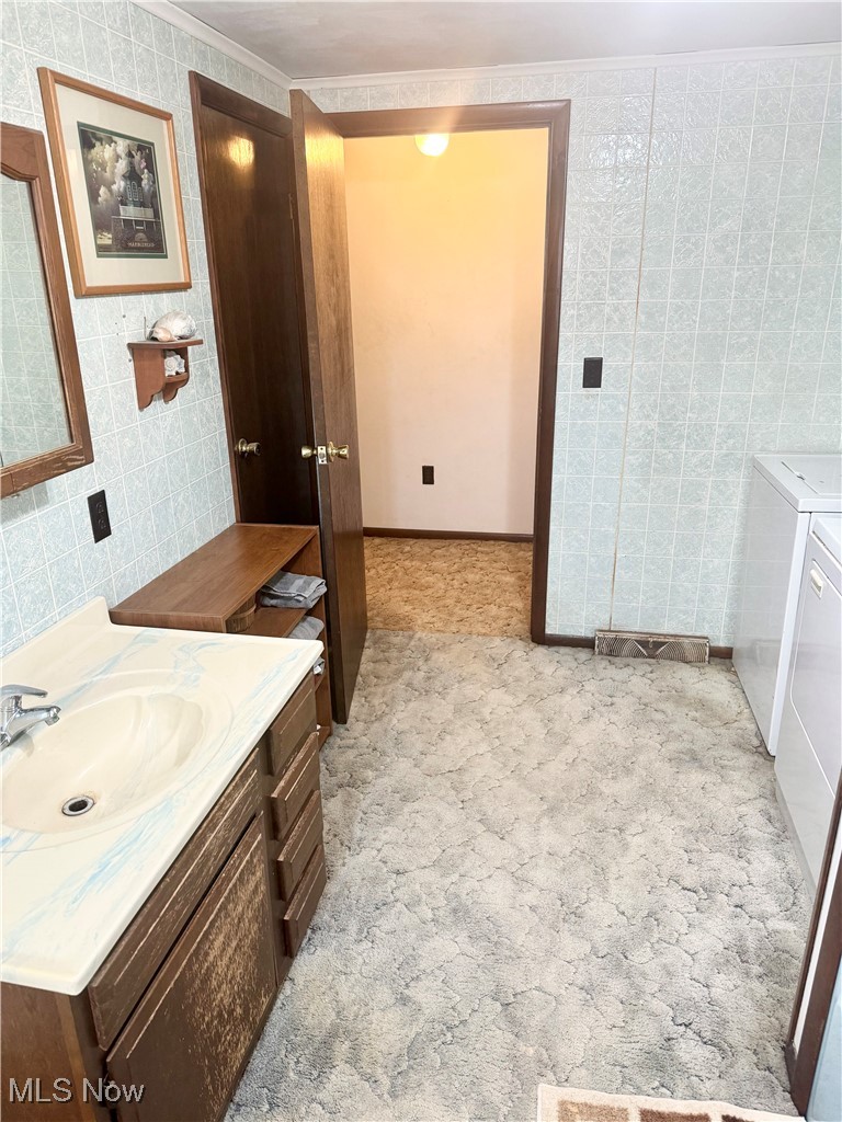 1457 St Johns Road Colliers, WV 26035 - Photo 14 of 38 Bathroom with washer, dryer and vanity