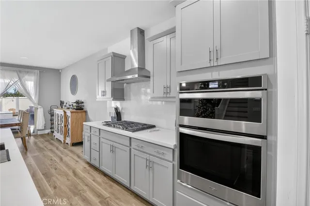 a stove top oven sitting inside of a kitchen
