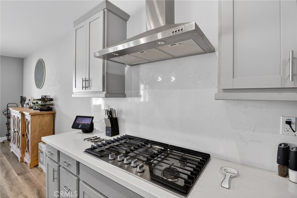 29608 Laredo Circle Menifee, CA 92584 - Photo 12 of 51 a stove top oven sitting inside of a kitchen
