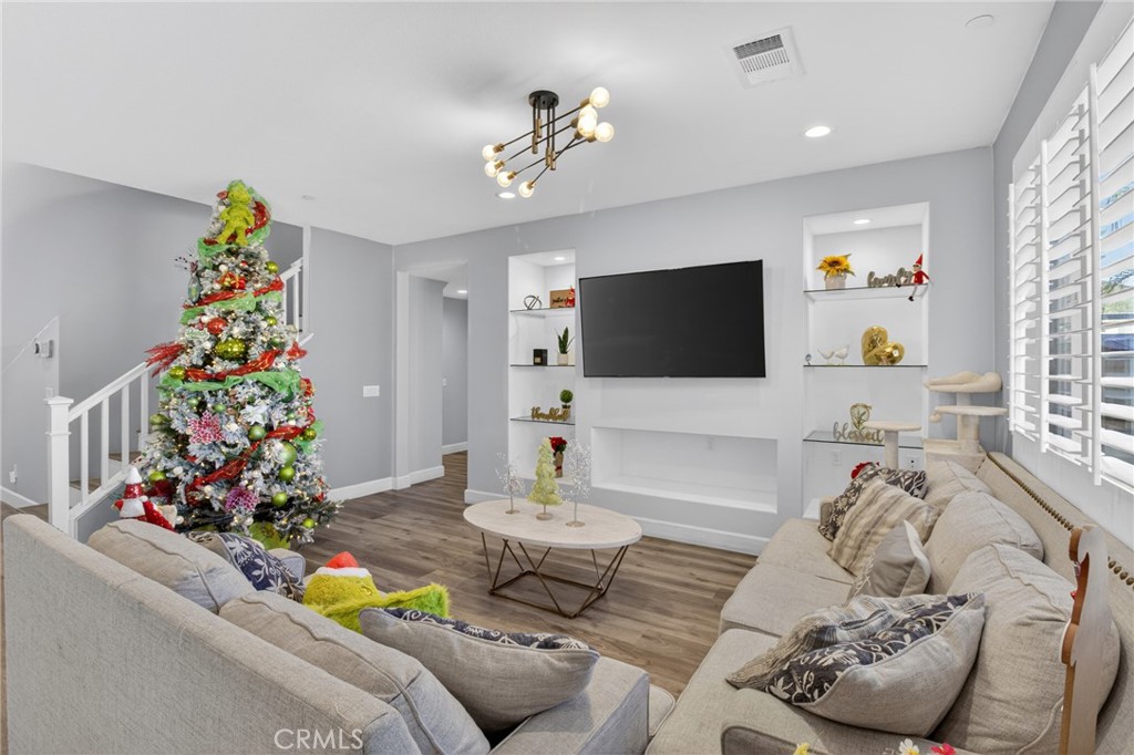 29608 Laredo Circle Menifee, CA 92584 - Photo 17 of 51 a living room with furniture and flowers