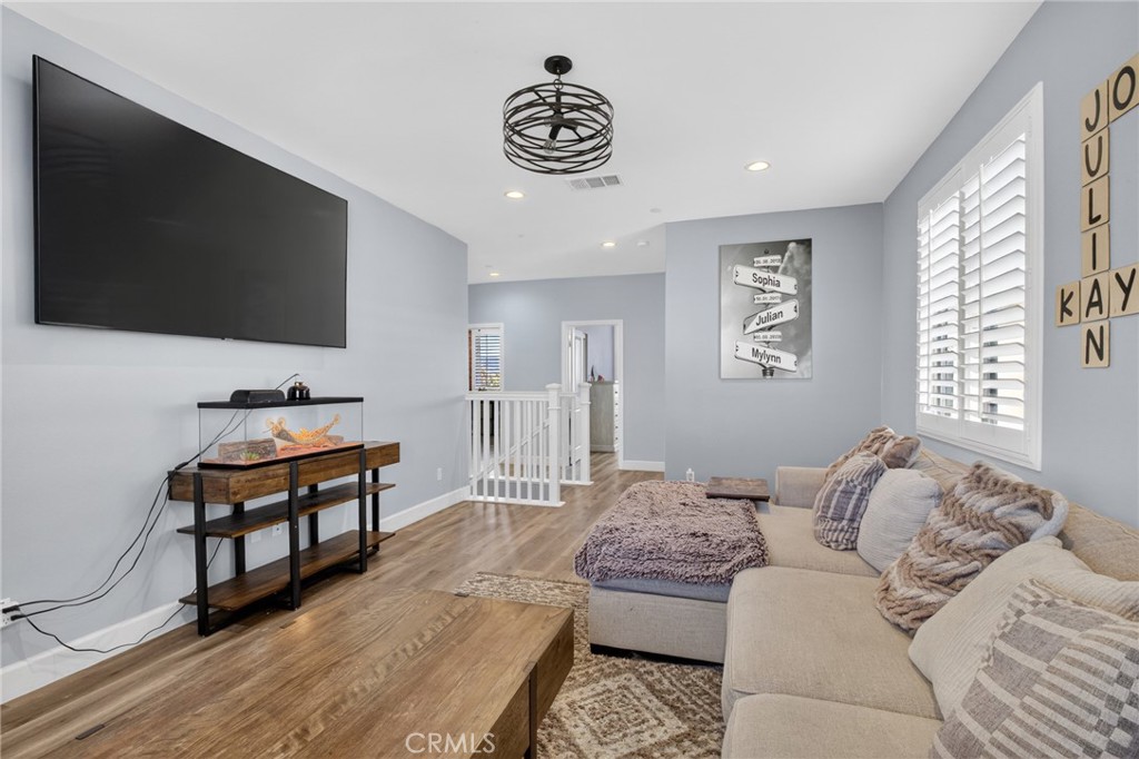 29608 Laredo Circle Menifee, CA 92584 - Photo 27 of 51 a bedroom with furniture and a flat screen tv