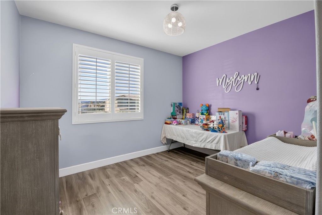 29608 Laredo Circle Menifee, CA 92584 - Photo 28 of 51 a bed room with a bed and a window