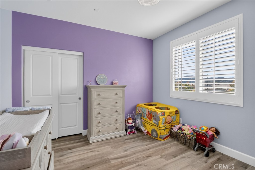 29608 Laredo Circle Menifee, CA 92584 - Photo 29 of 51 a bedroom with a bed and a window