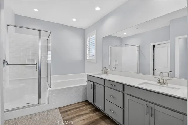a bathroom with a glass shower door