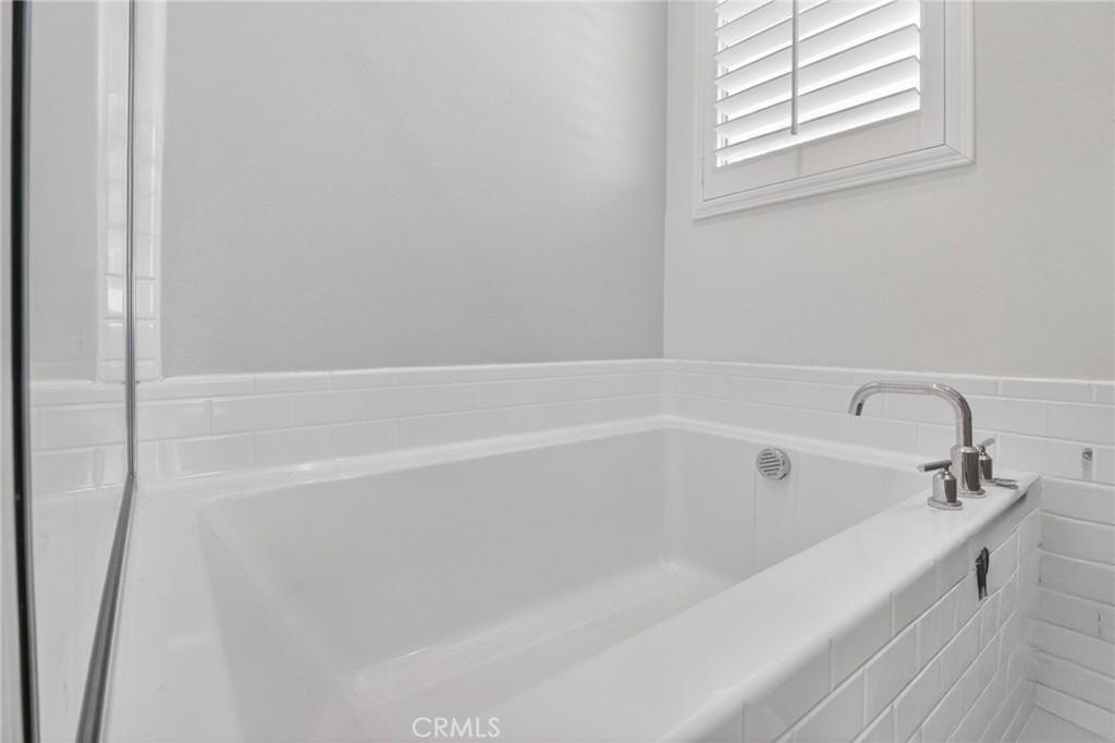 29608 Laredo Circle Menifee, CA 92584 - Photo 42 of 51 a white bath tub sitting next to a window