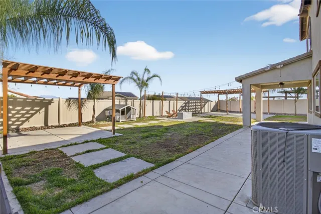 a view of a house with backyard and porch