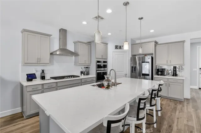 a kitchen with cabinets and appliances