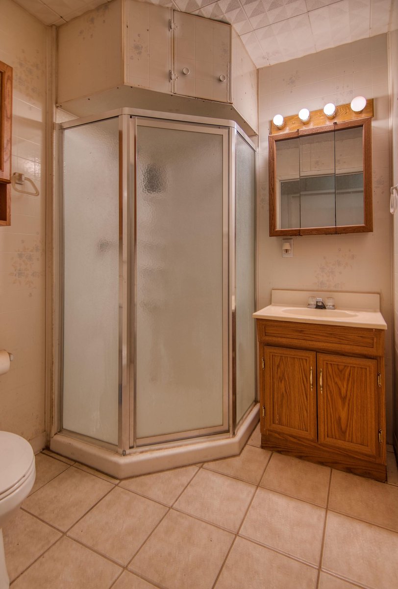 567 County Road 241 Rochelle, TX 76872 - Photo 18 of 31 Full bath with a shower stall, vanity, and light tile patterned flooring