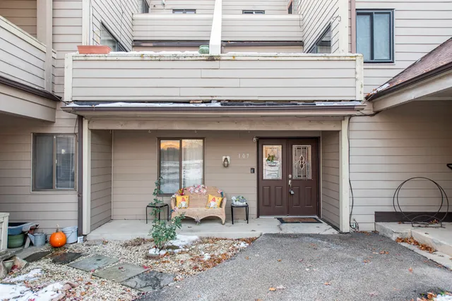 a view of a wooden door and a outdoor space