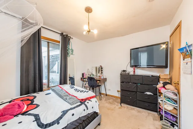 a view of a water pond with green yard