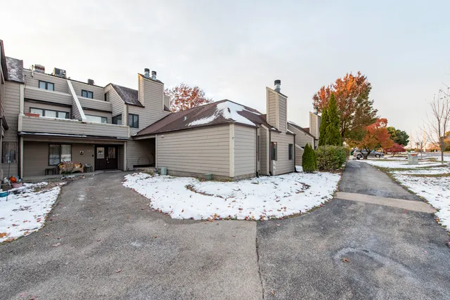 a view of a balcony with chairs