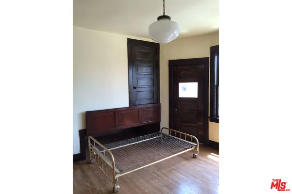 a view of an entryway with wooden floor