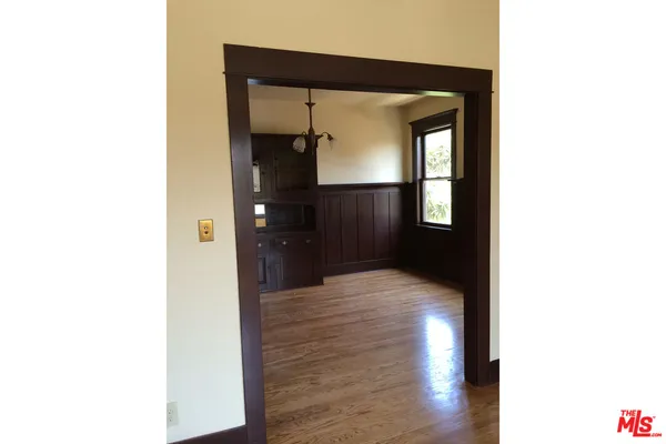 a view of an empty room with a fireplace