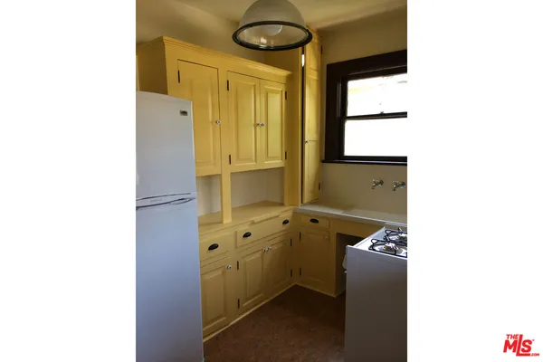 a bathroom with a toilet a sink and bathtub