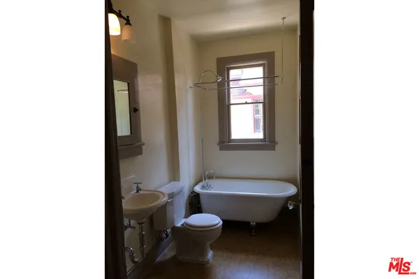 a view of a hallway with windows