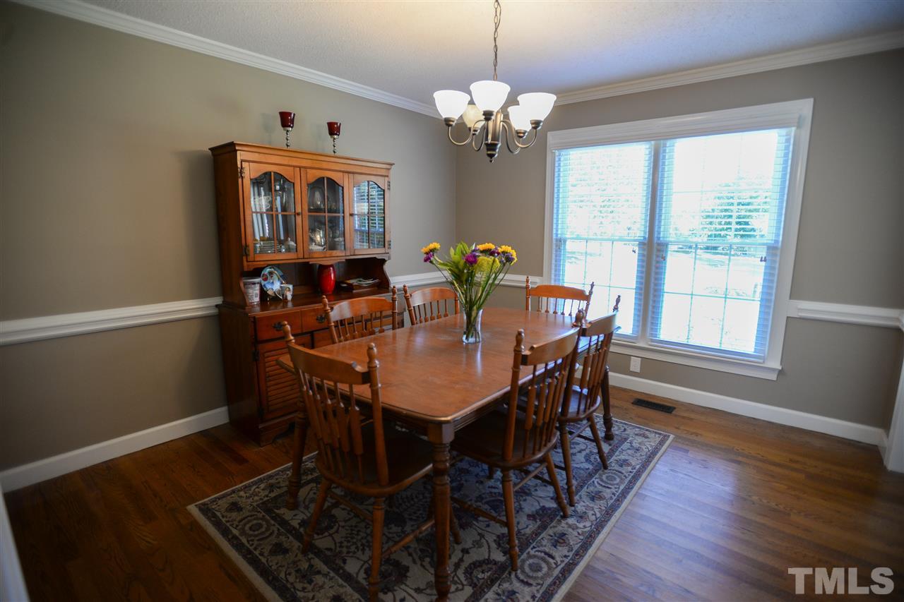 8501 Boot Court Raleigh, NC 27615 - Photo 3 of 21 Double window, crown and chair-rail are the perfect additions to this formal entertaining space