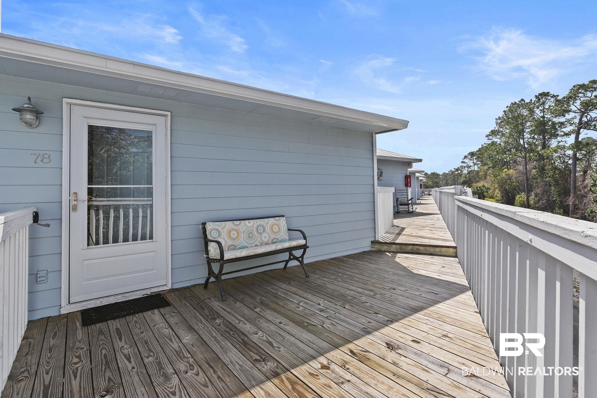 25861 Canal Road, Unit 78 Orange Beach, AL 36561 - Photo 6 of 45 View of wooden deck