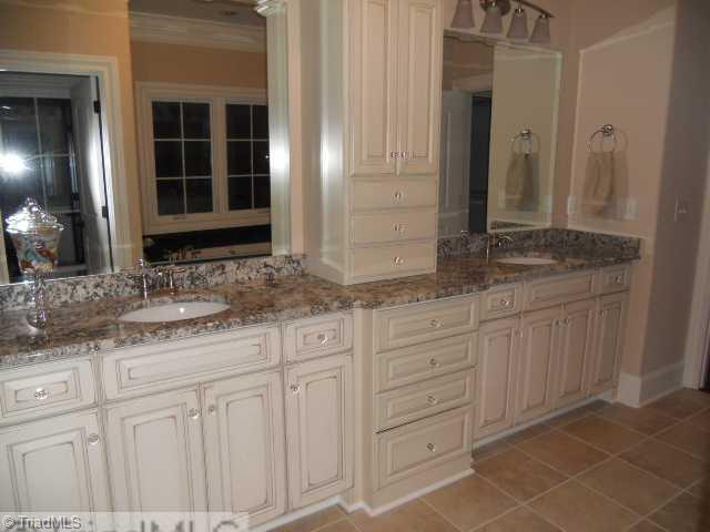 232 Beauchamp Road Advance, NC 27006 - Photo 11 of 16 Master Bath/Spa. Beautifil master Bath with Custom made Cabinets, Tub with Black Granite Top, Custom Tiled Shower and Seperate Toliet area.