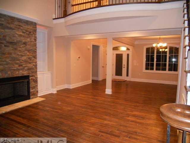 232 Beauchamp Road Advance, NC 27006 - Photo 5 of 16 Living Room. Open Living Room and Foyer to Dining Room With Column. Hardwood Floors on main Level.