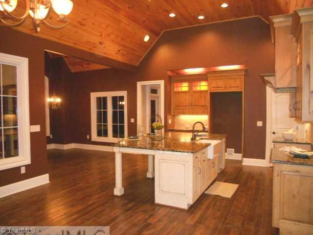 232 Beauchamp Road Advance, NC 27006 - Photo 9 of 16 Kitchen. Kitchen open to Eating Area. Satinless Appliances will occupay this gourmet Kitchen. Granet tops. Farmer Sink. " Coffered Ceilings" !!