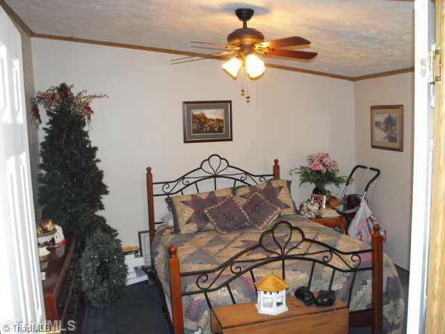260 Oak Ridge Drive Elkin, NC 28621 - Photo 9 of 16 4th Bedroom. THIS LARGE ROOM COULD BE A STUDY OR 4TH BEDROOM. BUYER / AGENT TO CONFIRM IF SEPTIC SYSTEM IS FOR 3 OR 4 BEDROOMS.