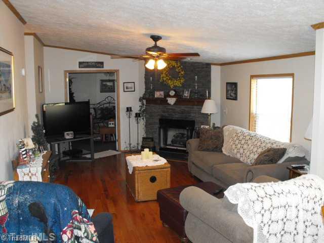 260 Oak Ridge Drive Elkin, NC 28621 - Photo 2 of 16 Den/Family/Great Room. LARGE DEN WITH WOOD BURNING OR GAS LOG FIREPLACE.