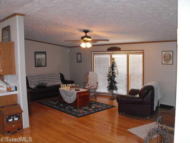 260 Oak Ridge Drive Elkin, NC 28621 - Photo 16 of 16 Living Room. THE LIVING ROOM IS OPEN TO THE KITCHEN, DR, AND DEN MAKING A VERY LARGE OPEN FLOOR PLAN AREA.