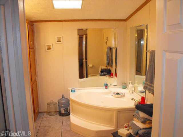 260 Oak Ridge Drive Elkin, NC 28621 - Photo 6 of 16 Master Bath/Spa. THE MASTER BATH HAS A GARDEN TUB, SEPARATE SHOWER AND SKYLIGHT.