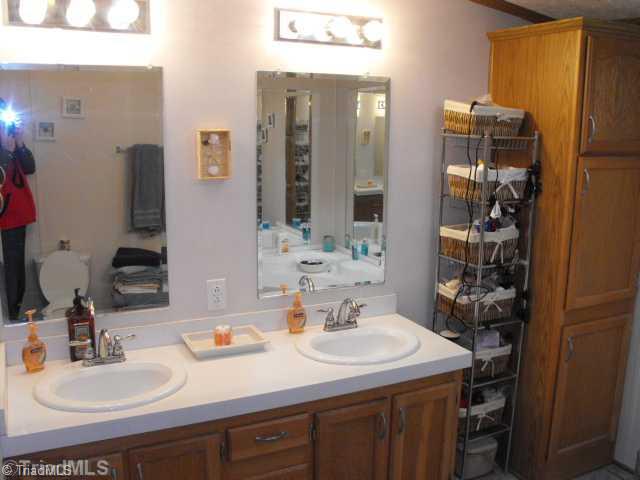 260 Oak Ridge Drive Elkin, NC 28621 - Photo 7 of 16 Master Bath/Spa. THE MASTER BATH HAS A DOUBLE VANITY AND TWO LINEN CLOSETS.