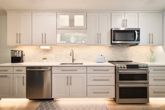 a kitchen with a stove and a microwave