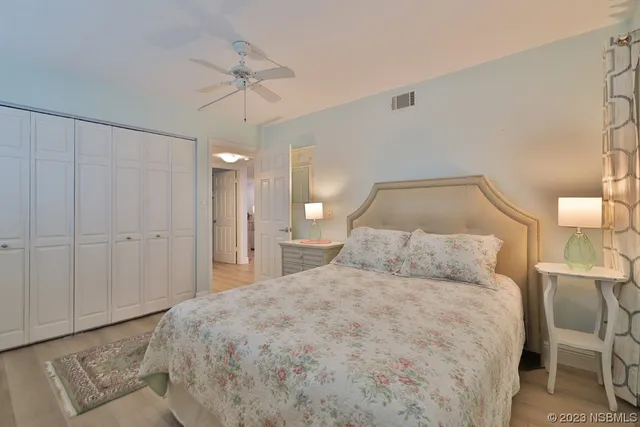 a bathroom with a granite countertop sink toilet a mirror and shower