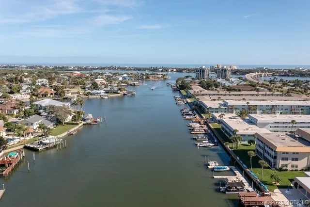 a kitchen with kitchen island a sink table and chairs