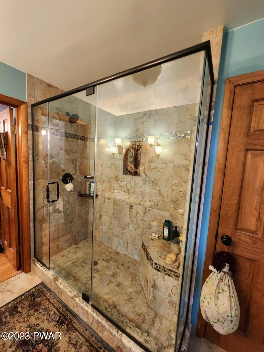 114 Rim Rock Road Milford, PA 18337 - Photo 16 of 25 a bathroom with a glass shower door