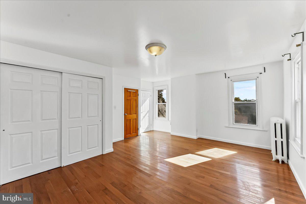 85 Price Street Bala Cynwyd, PA 19004 - Photo 16 of 44 an empty room with wooden floor and windows