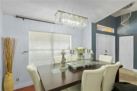 a dining room with furniture and window