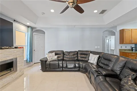 a living room with furniture and a fireplace