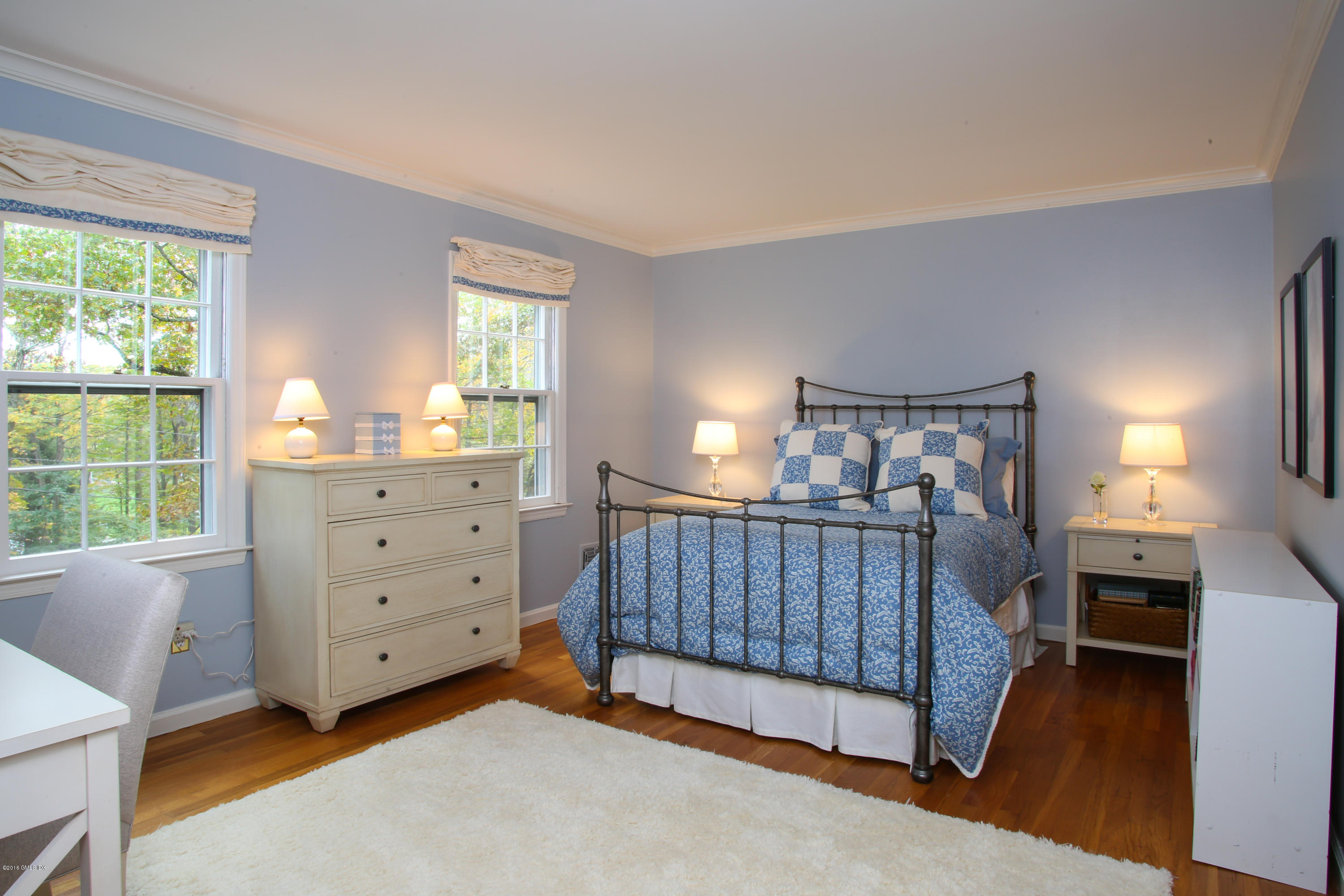 36 Burning Tree Road Greenwich, CT 06830 - Photo 11 of 25 a view of a bedroom with furniture and windows