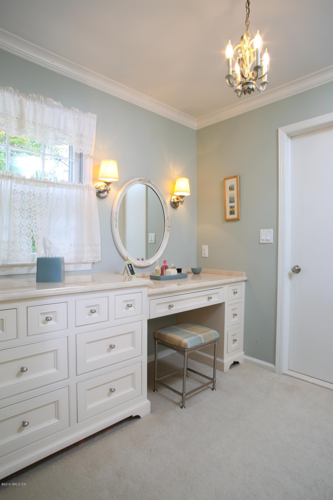 36 Burning Tree Road Greenwich, CT 06830 - Photo 13 of 25 a view with double vanity sink a mirror a window and a lamp