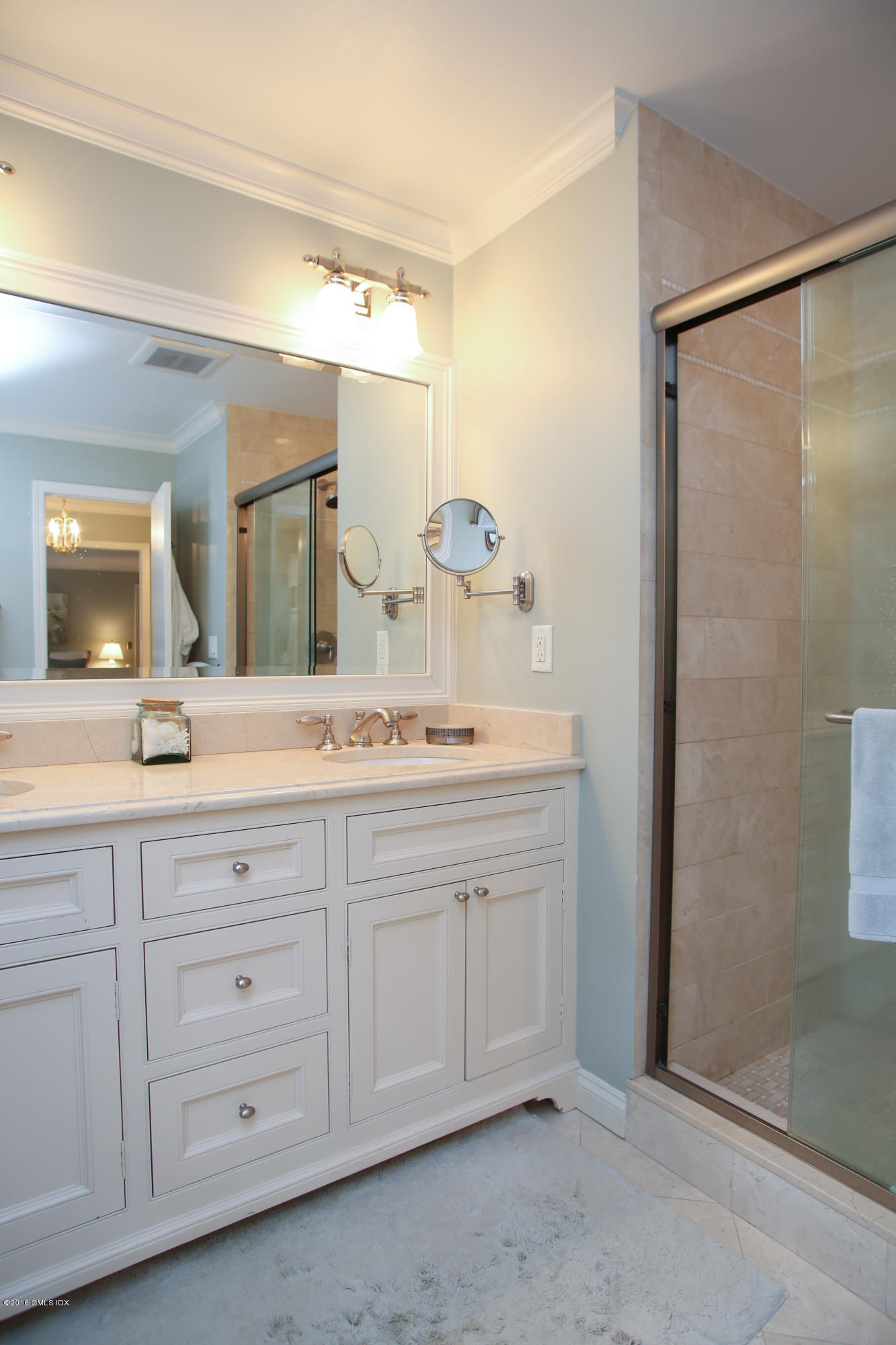 36 Burning Tree Road Greenwich, CT 06830 - Photo 14 of 25 a bathroom with a double vanity sink and a mirror