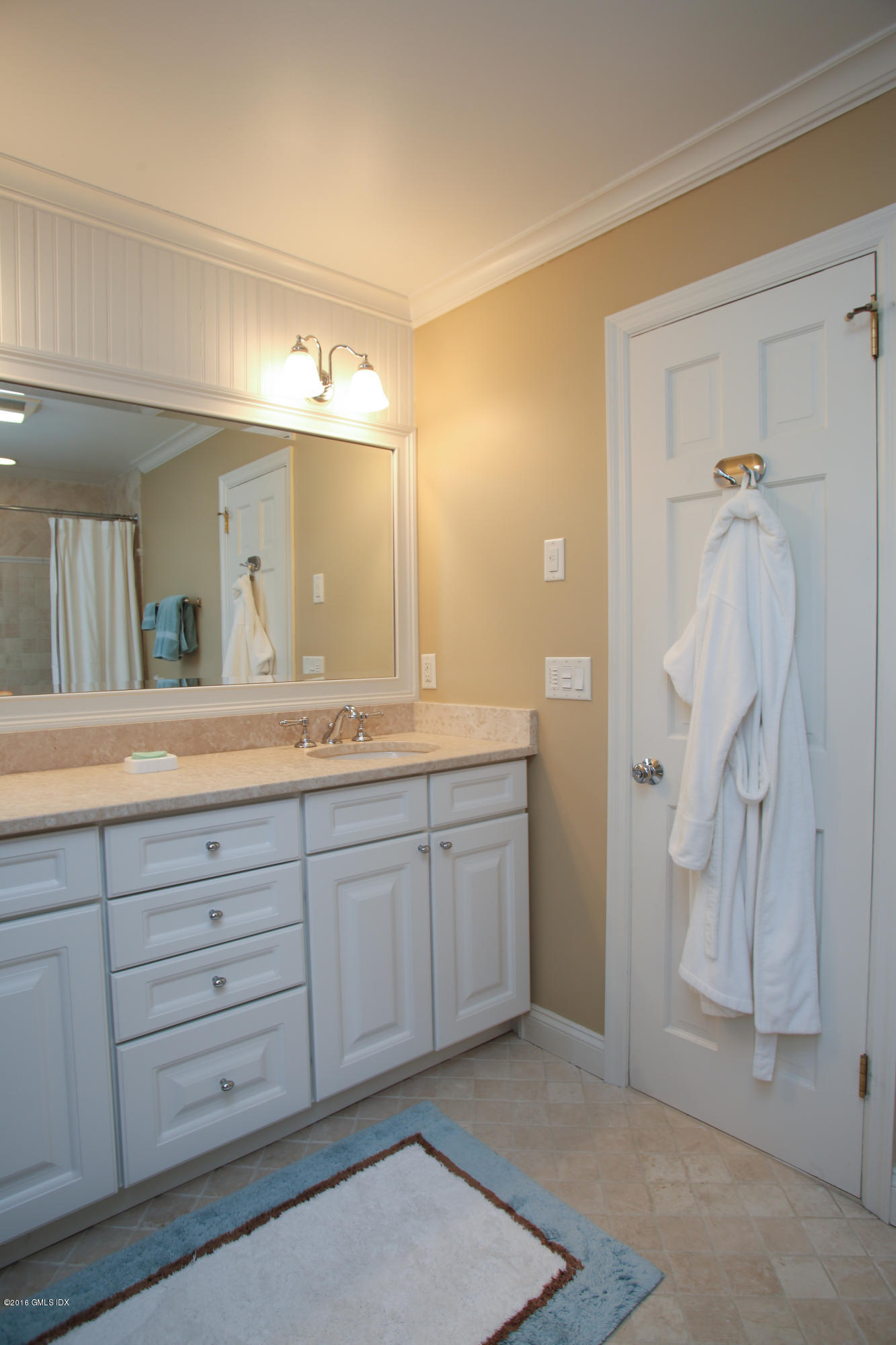 36 Burning Tree Road Greenwich, CT 06830 - Photo 15 of 25 a bathroom with a granite countertop sink mirror and a