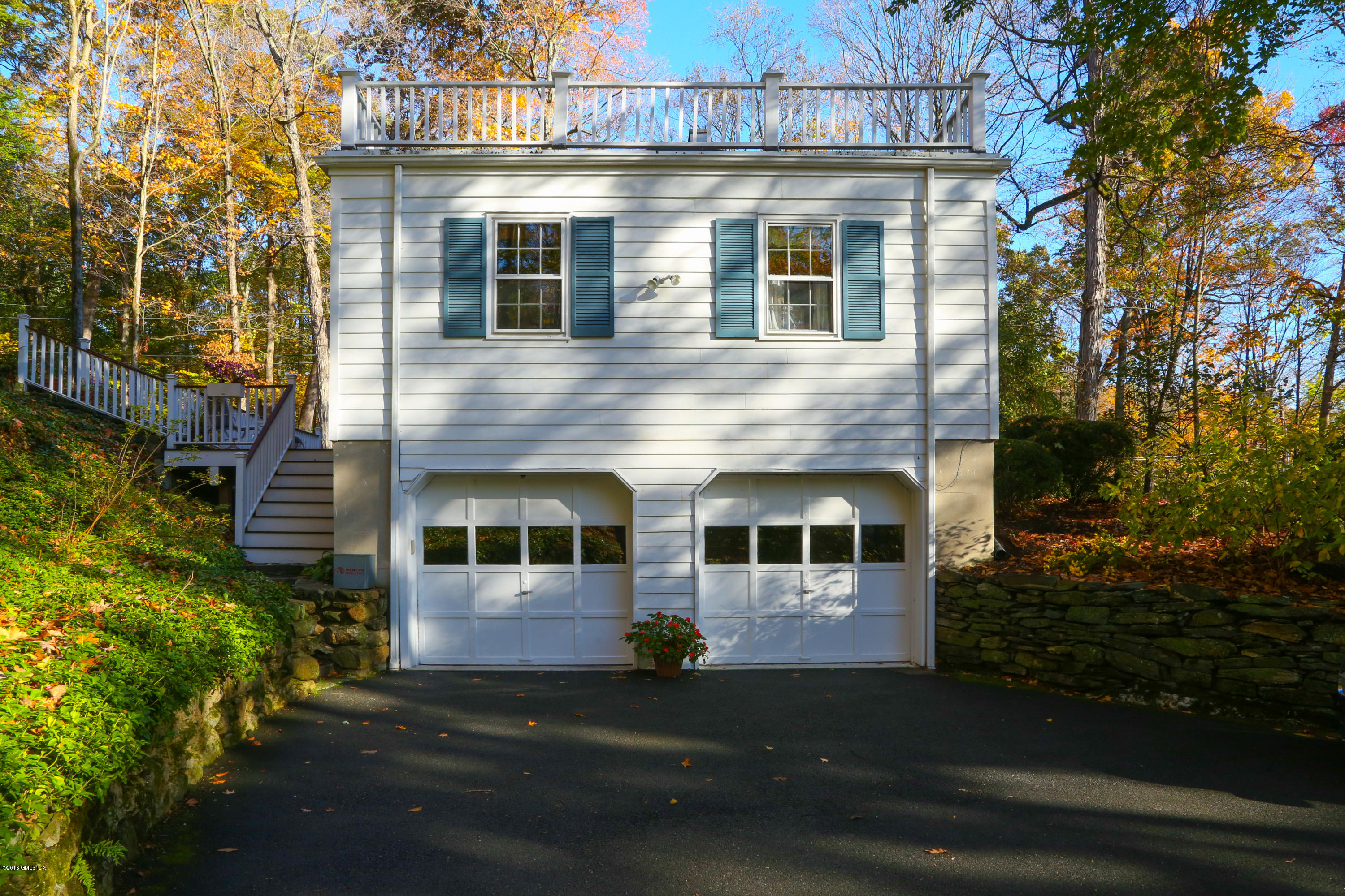 36 Burning Tree Road Greenwich, CT 06830 - Photo 25 of 25 a front view of a house with a yard