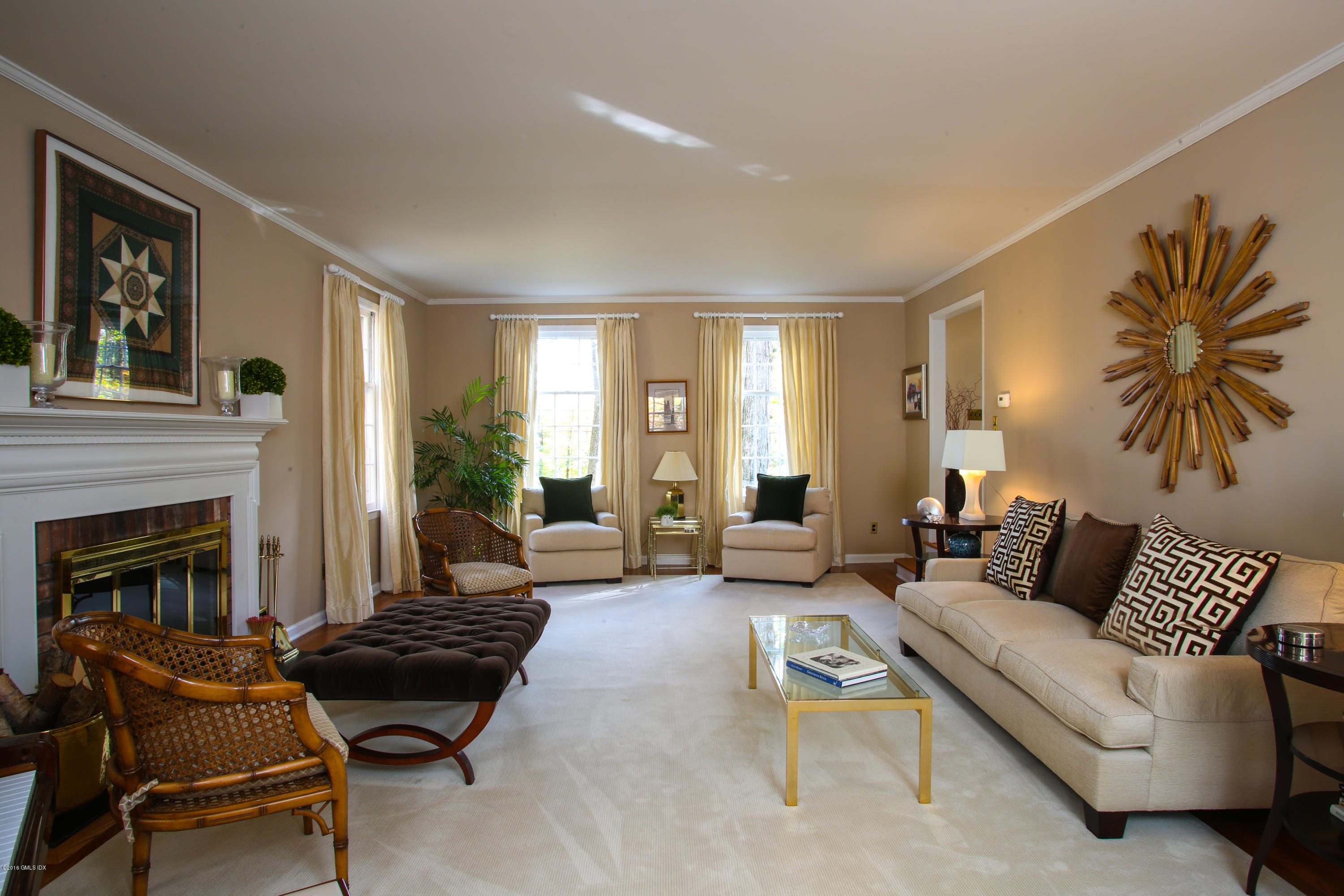 36 Burning Tree Road Greenwich, CT 06830 - Photo 5 of 25 a living room with furniture and a fireplace