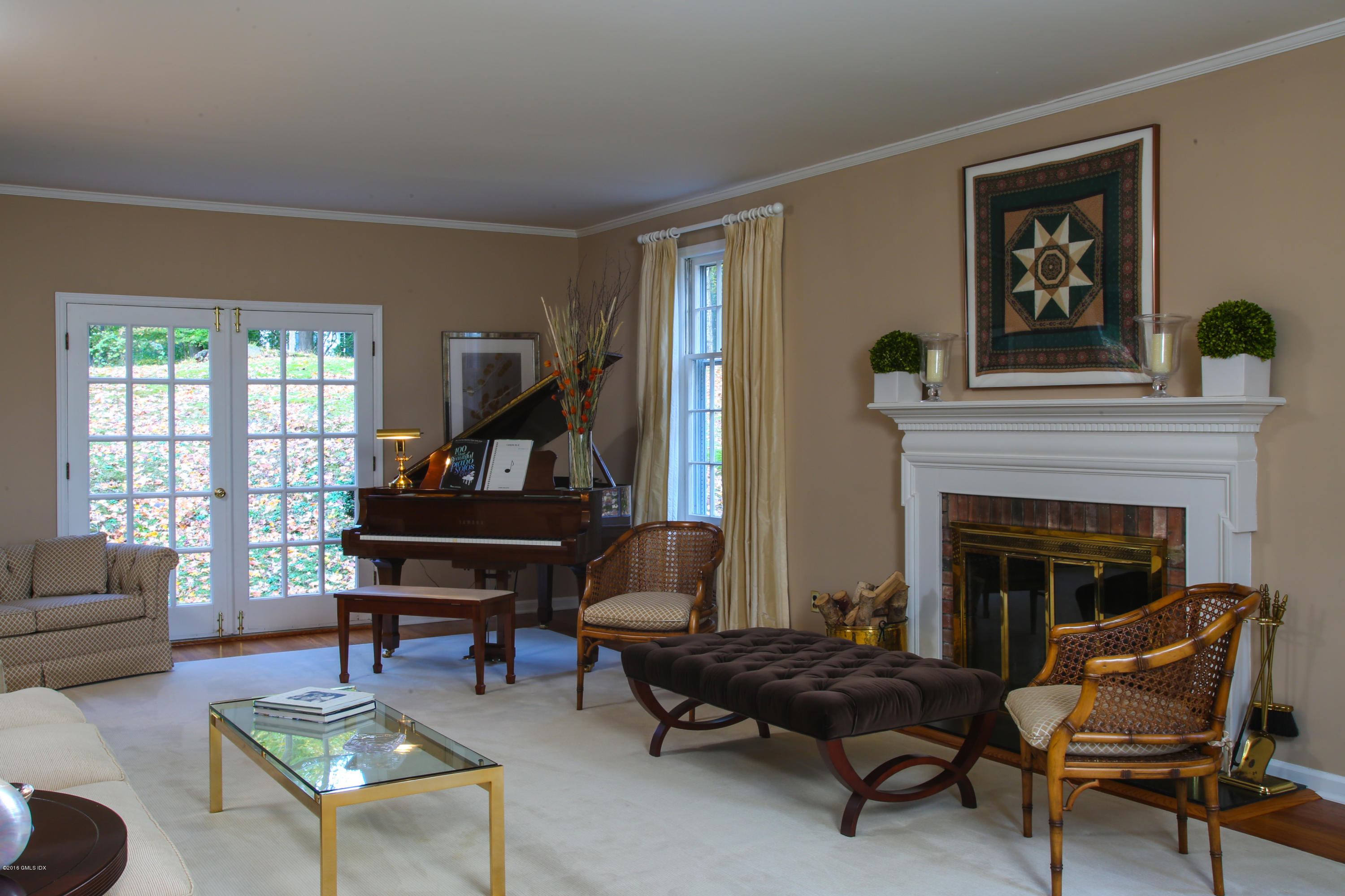 36 Burning Tree Road Greenwich, CT 06830 - Photo 6 of 25 a living room with furniture and a fireplace