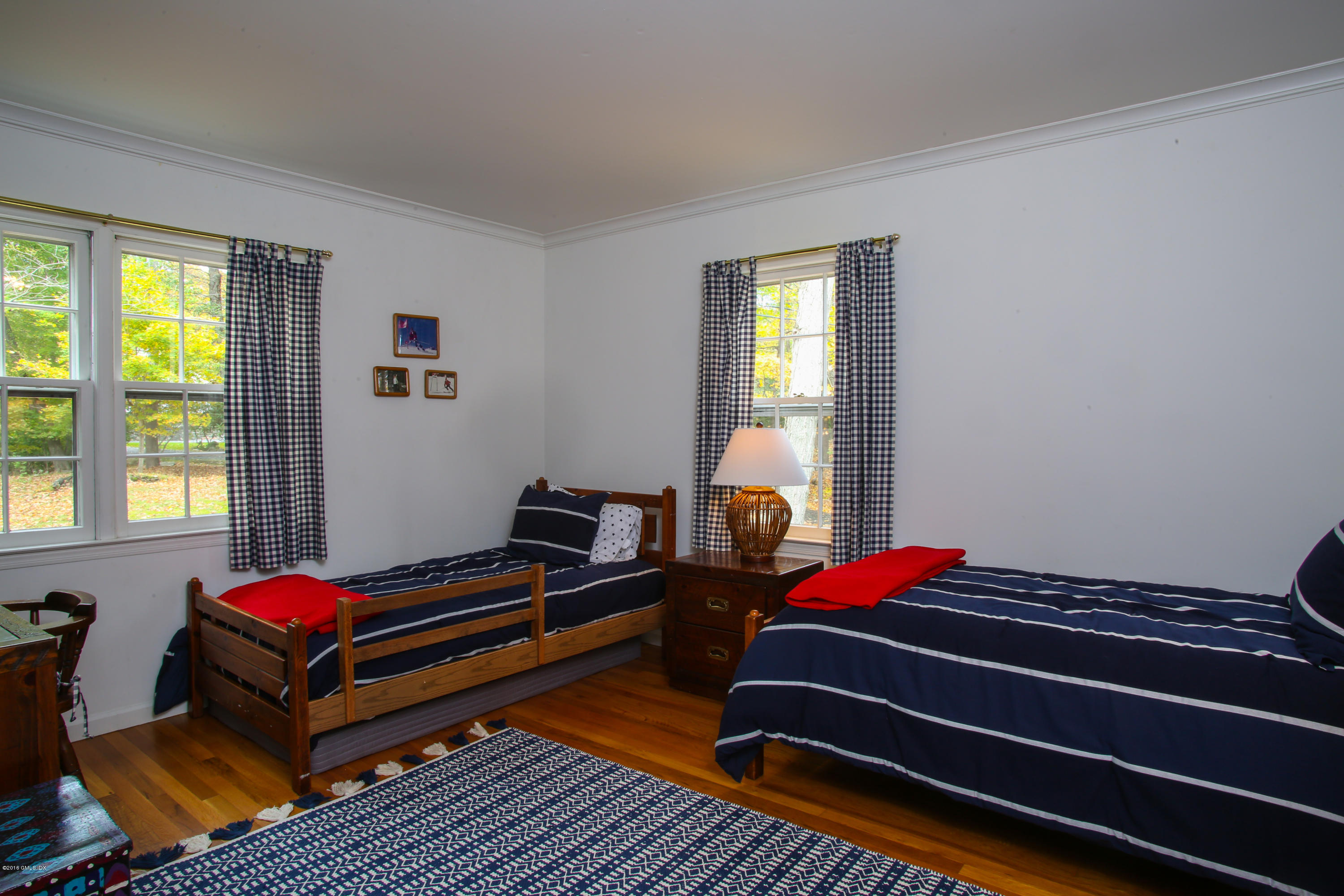 36 Burning Tree Road Greenwich, CT 06830 - Photo 10 of 25 a room with a bed and a window