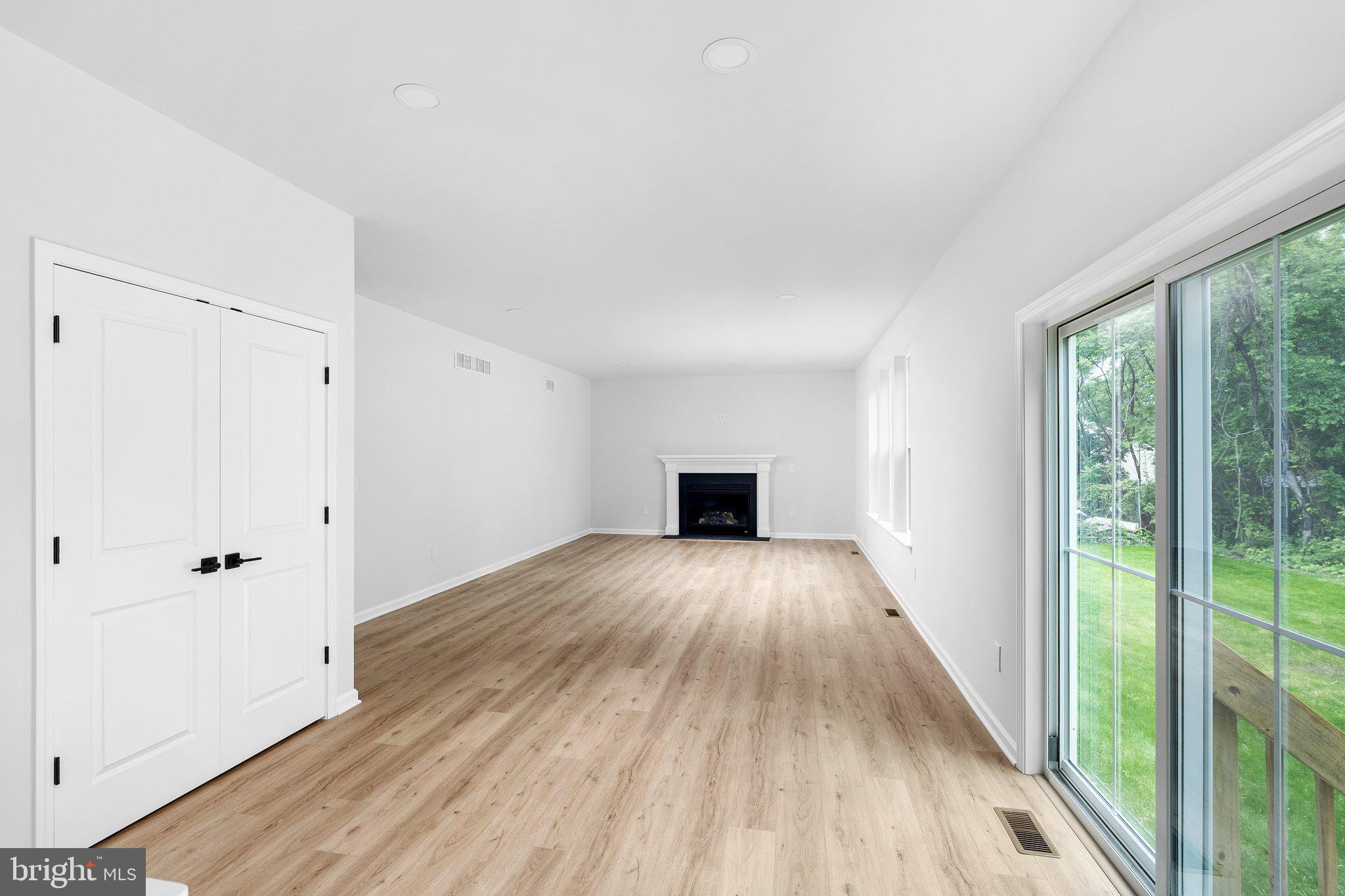 4913 South Broad Street Hamilton, NJ 08620 - Photo 12 of 31 a view of empty room with wooden floor and fan