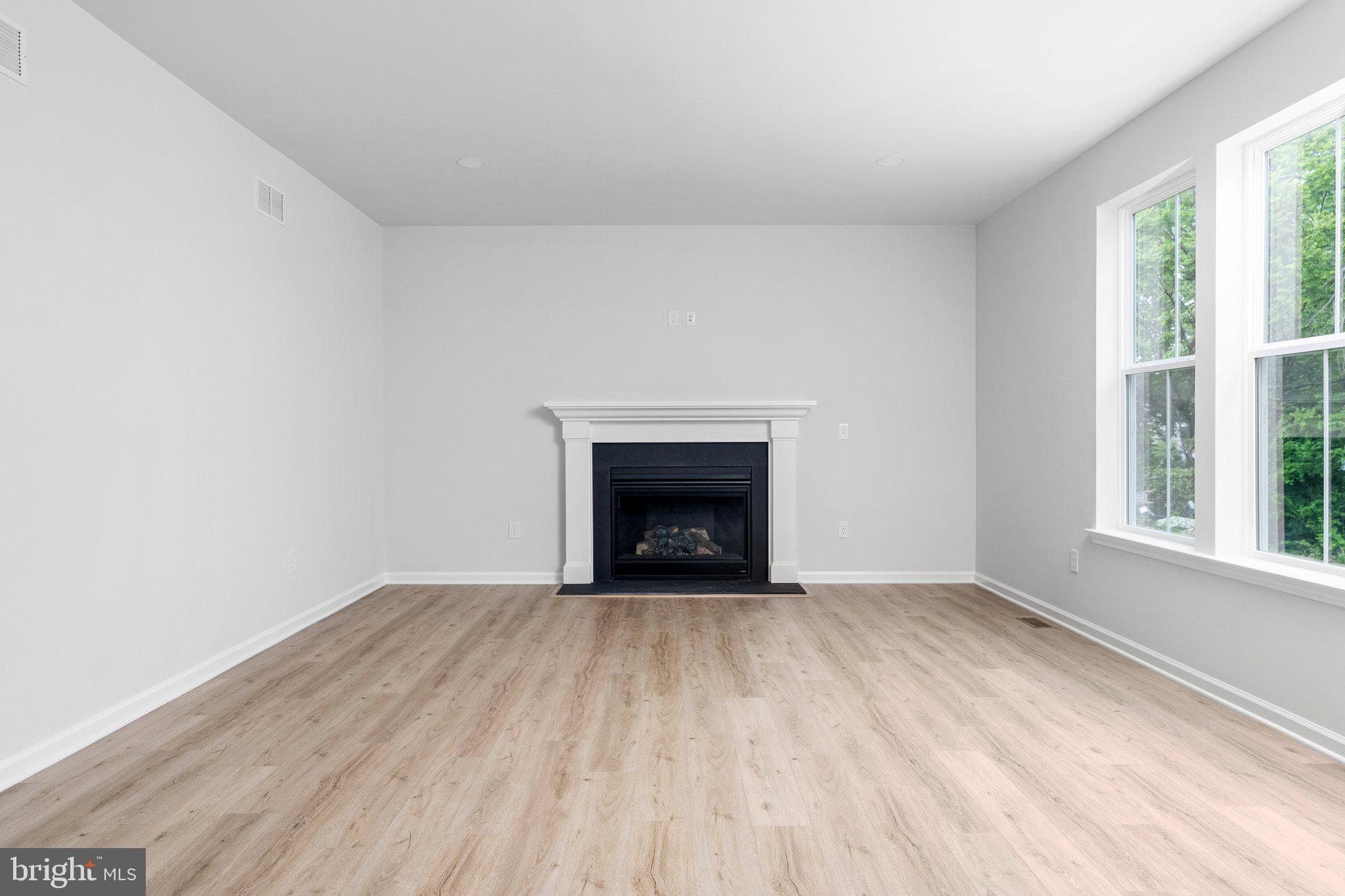 4913 South Broad Street Hamilton, NJ 08620 - Photo 17 of 31 a view of an empty room with a window and a fireplace